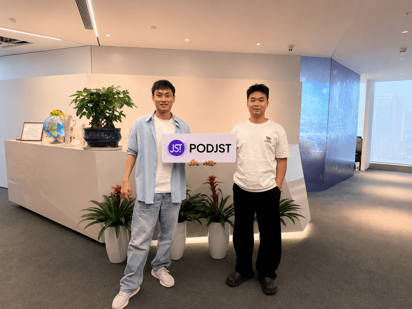 PODJST founders standing together in the company office