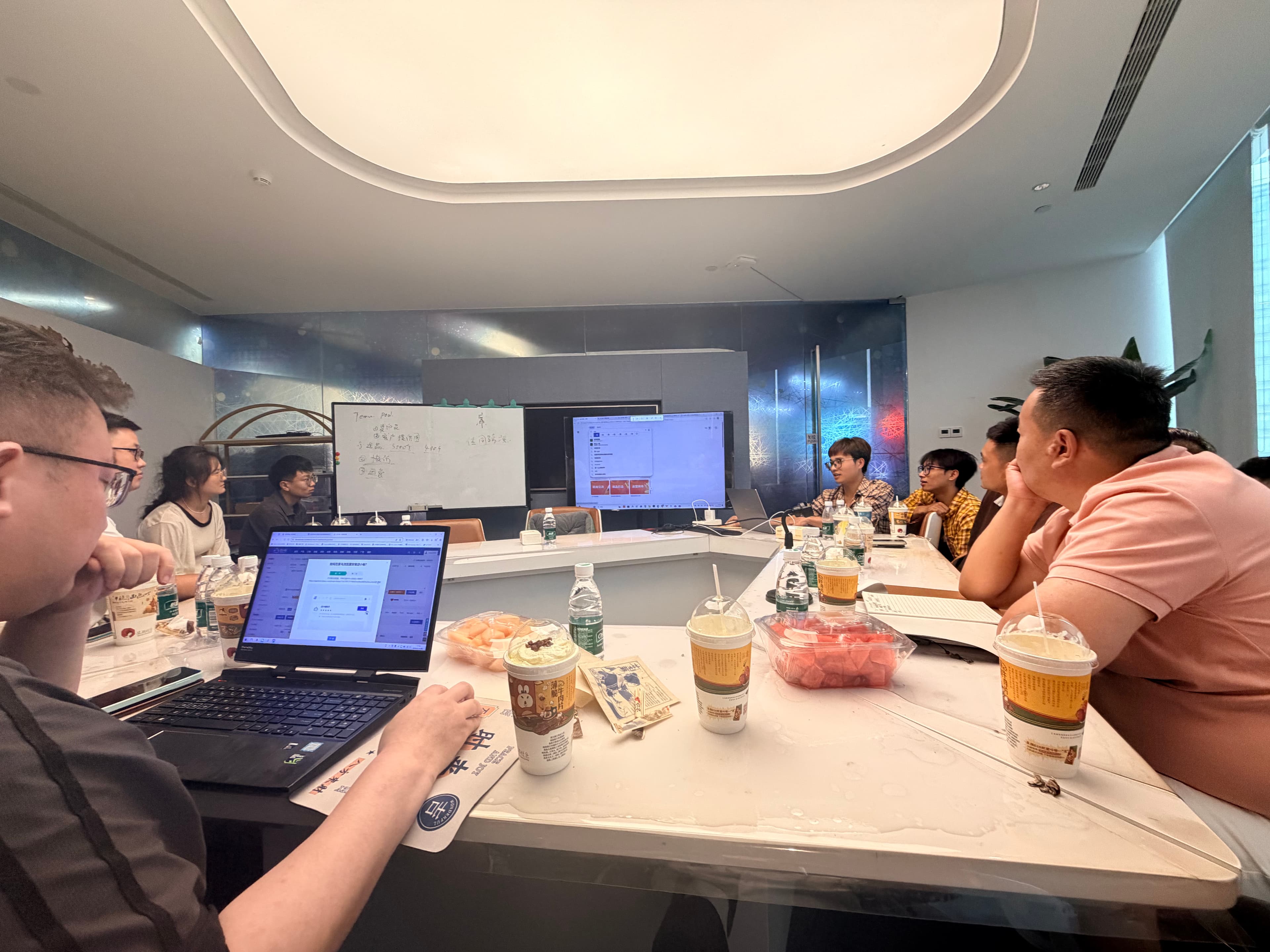 PODJST team reviewing project updates around a conference table